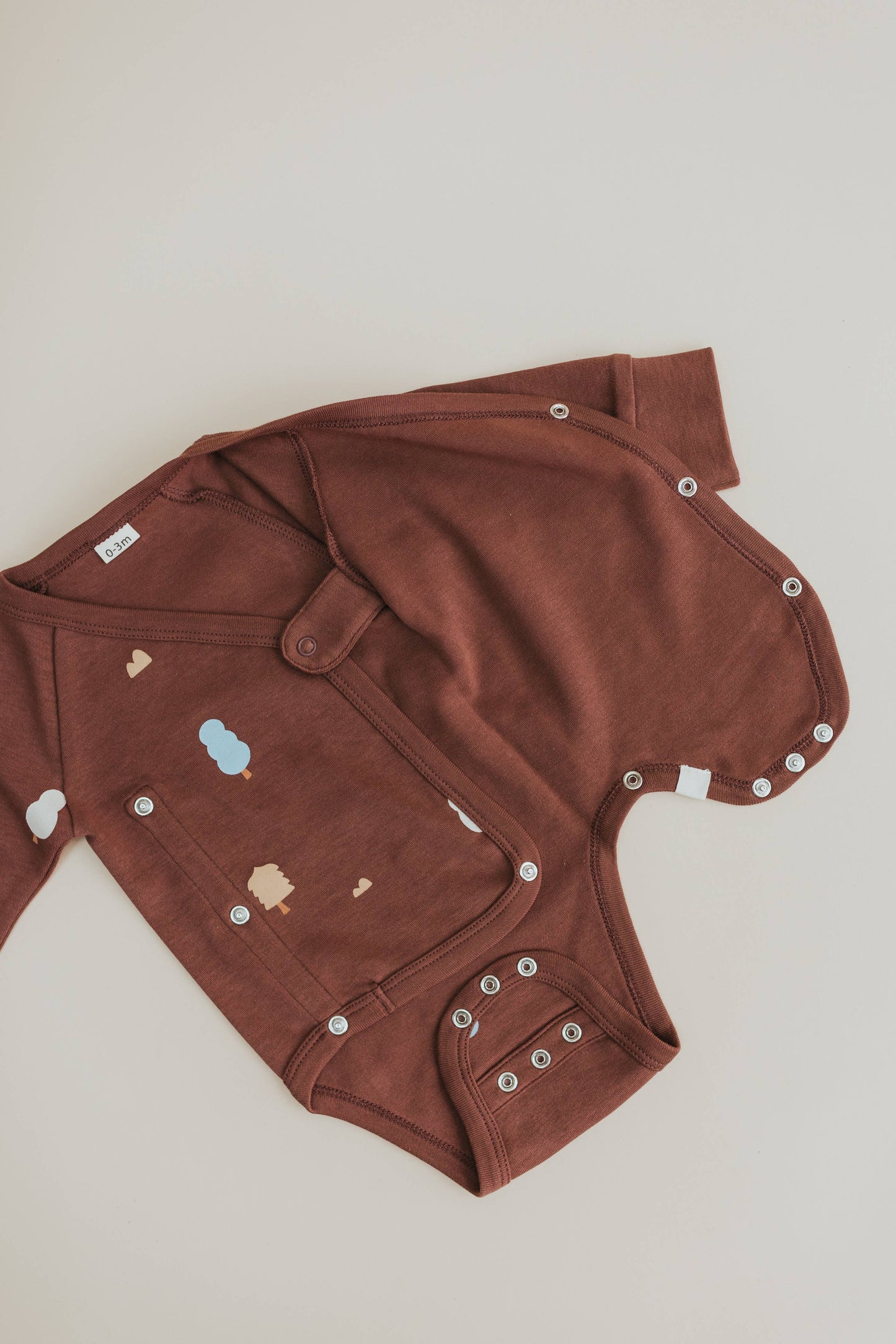 Organic Cotton Wrap Over Long Sleeve Bodysuit in Raisin